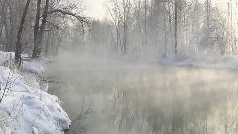 Mist over river in winter forest. Winter landscape. Stock Footage 83082002
