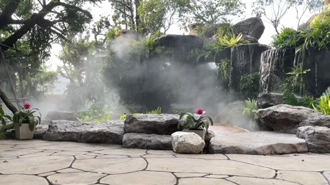 Mist over small waterfall. Backyard garden waterfall with Mist. Stock Footage 253962759