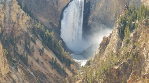 Mist rises from Lower Yellowstone Falls Stock Footage 141810634