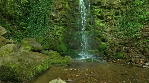 Mist rises from a narrow waterfall. Balkans, Serbia. Stock Footage 336894412