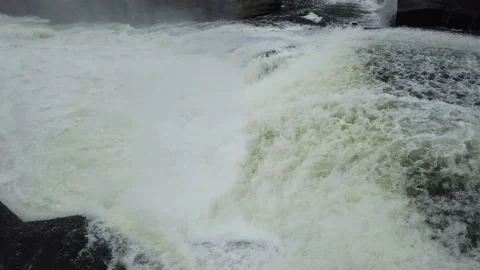 Mist rising from falls in a raging river Stock Footage 138650684