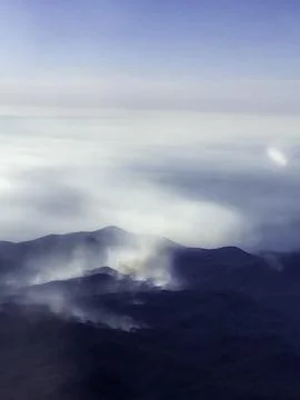 Mist Rising Over Mountain Range Foto stock