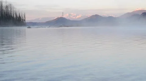 Mist rising from the river Video stock 63456066