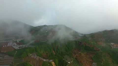 Mist Rolling Across Agricultural Mountain Landscape Captured by Drone Stock Footage 341352003