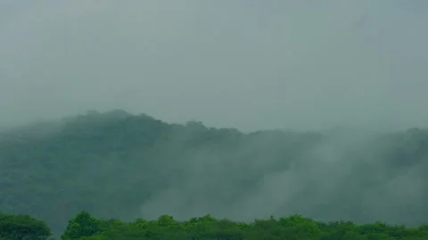 Mist rolling over hills timelapse Stock Footage 322725867