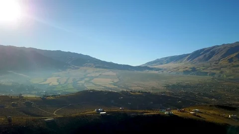 Mist, Sun and mountains during sunset, Dolly aerial footage Stock Footage 88564986
