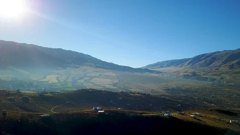 Mist, Sun and mountains during sunset, aerial footage Stock Footage 88565654
