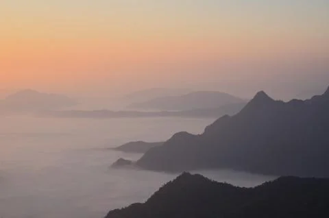 Mist before sunset between moutains Stock Photos