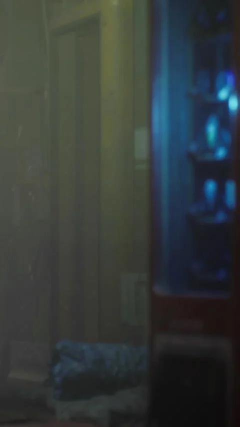 Mist surrounds a vending machine in a dimly lit room at night Stock Footage 334262771