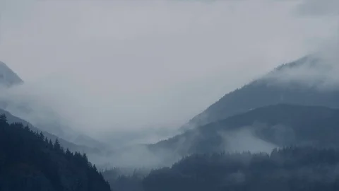Mist Swirling Over Vast Mountain Landscape Stock Footage