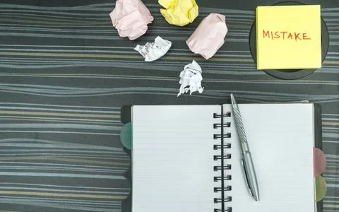 Mistake written on sticky notes. Learning, wrong, blooper, error, regret sayi Stock Photos