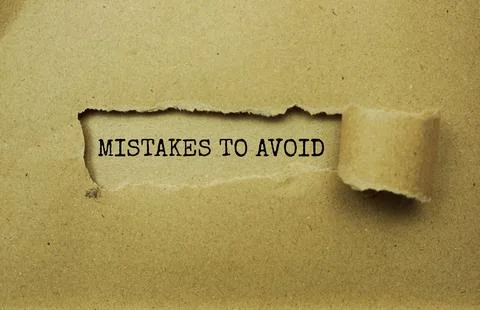 Mistakes To Avoid message written on craft paper with torn paper background 库存照片