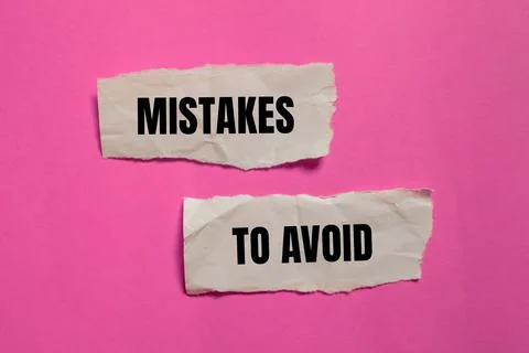 Mistakes to avoid message written on ripped paper pieces with pink backgrou.. Stock Photos