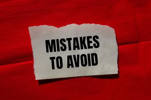 Mistakes to avoid message written on ripped torn paper piece on red backgro.. Foto stock