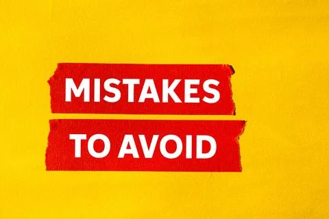 Mistakes to avoid message written on ripped torn red paper tape on yellow b.. 库存照片