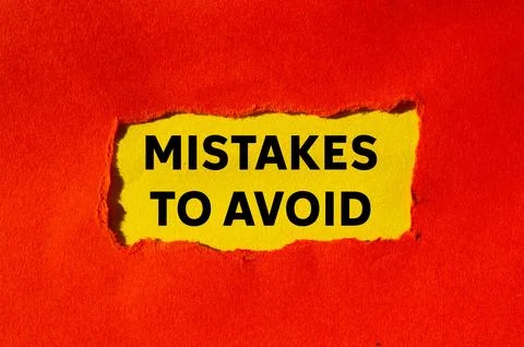 Mistakes to avoid message written on ripped torn red paper on yellow backgr.. Foto stock
