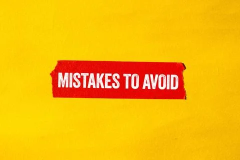 Mistakes to avoid message written on ripped torn red paper tape on yellow b.. Foto stock