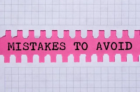 Mistakes to avoid message written on ripped torn paper on pink background. .. Foto stock