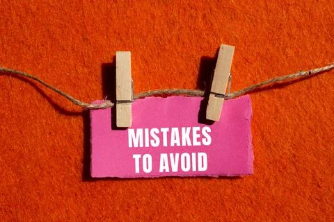 Mistakes to avoid message written on ripped torn paper background. Conceptu.. Foto stock