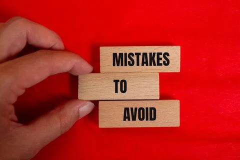 Mistakes to avoid message written on wooden blocks with color background. Con Foto stock