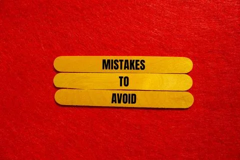 Mistakes to avoid message written on yellow wooden sticks with red backgrou.. 写真素材