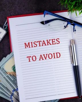 MISTAKES TO AVOID, text in a notebook, a vertical photo Stock Photos