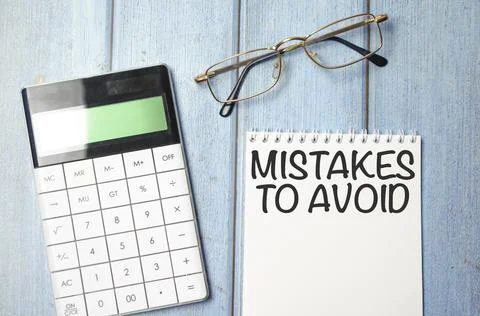 Mistakes to avoid text on the sticker with calculator and glasses Stock Photos