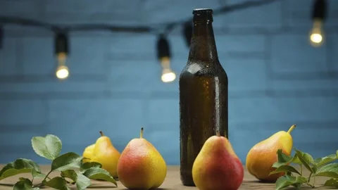 Misted bottle of cider and pears Stock Footage 142737233