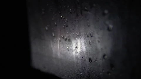 Misted car window with water drops at night Stock Footage 147625193