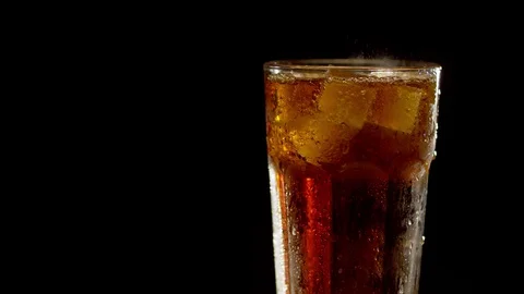 Misted glass of cola turning Stock Footage 127444129