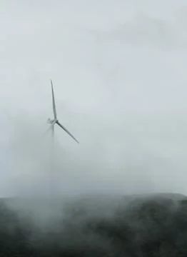 Misted wind turbine Stock Photos