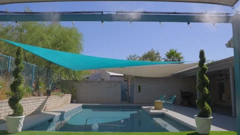 Misters overlooking pool Stock Footage 245512041