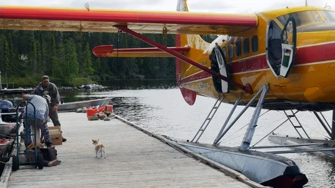 Mistissini, Quebec/Canada - 08 14 2017: Passengers exiting Cree Twin Otter plane Stock Footage 125636835