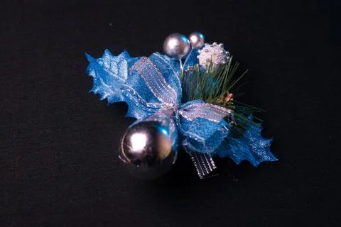 Mistletoe berries and pine tree branches on a black background Stock Photos