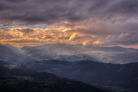 Mists and clouds between the valleys and mountains Stock Photos