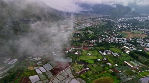 Misty Aerial View of Patchwork Farmland at Bukit Selong, Lombok Stock Footage 313253426