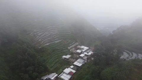 Misty Aerial View of Terraced Fields and Village in Dieng Plateau, Indonesia Stock-Footage 280018181