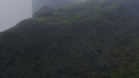Misty Basalt Columns and Green Slopes in Iceland Mountain Landscape Stock Footage 341295131