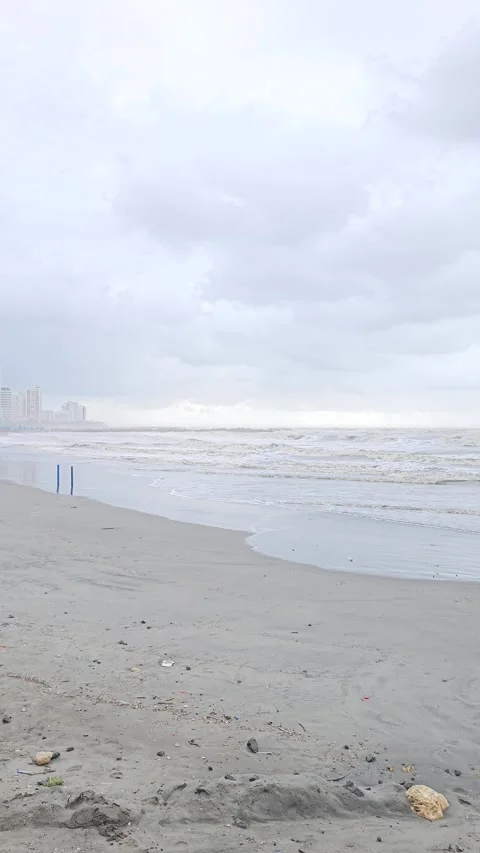 Misty Beach and Surf With Distant High-Rises, Cartagena, Colombia – Vertical 8K Stock-Footage 331502429