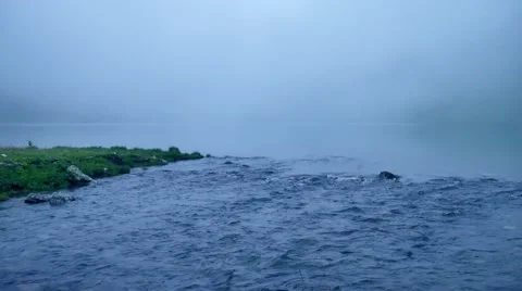 Misty calm lake and source of the river. Place where river begins Stock Footage 65774535