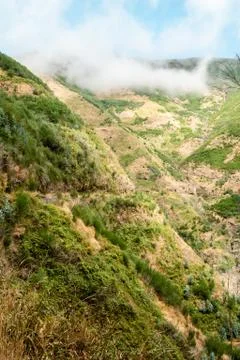 Misty cloud at the top of a mountain Stock Photos