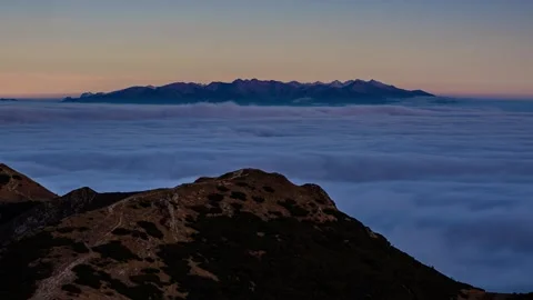 Misty clouds motion fast in Alps mountains valley in autumn nature evening Stock Footage 307643375