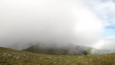 Misty clouds over the mountains. Stock Footage 142748610
