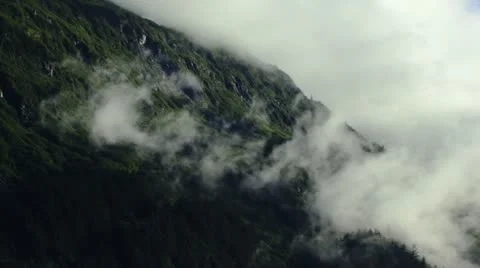 Misty Clouds Overtaking Mountain Ridge Stock Footage 11891285