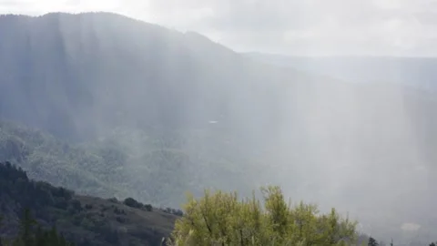 Misty Clouds Resting in a MOUNTAINSIDE Valley on a Spring Day, (HD 24p) Stock Footage 272170802