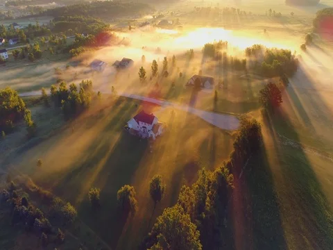 Misty country landscape at dawn, aerial view Stock Footage