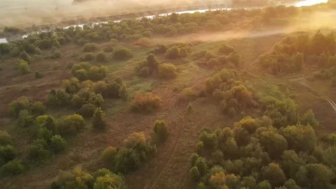 Misty dawn on the river with the first sunrays. Video stock 285052543