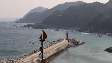 Misty Day at Imwon Port with Red Lighthouse Stock Footage 260173955