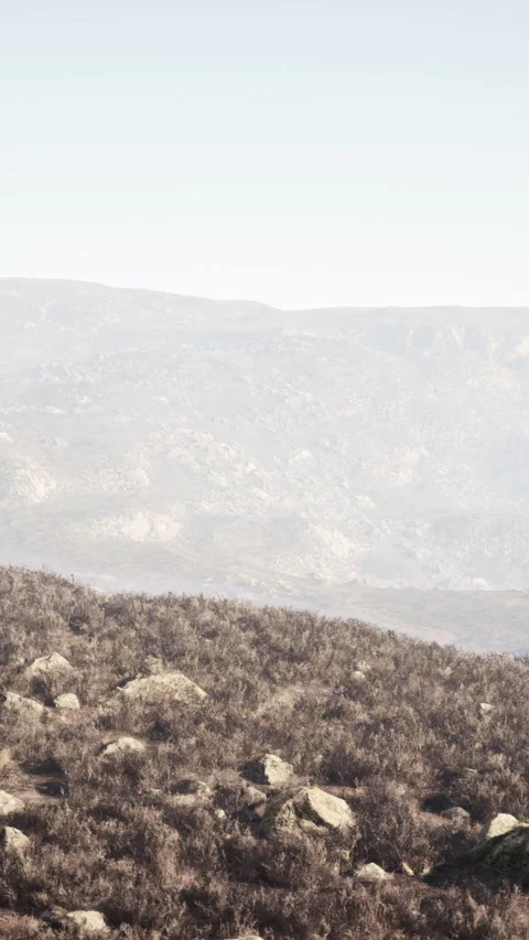 Misty daybreak on a mountain plateau between rocky peaks Stock Footage 304508948