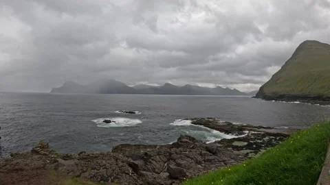 Misty distant islands and rugged volcanic coastline, Faroe Islands Stock Footage 340026882